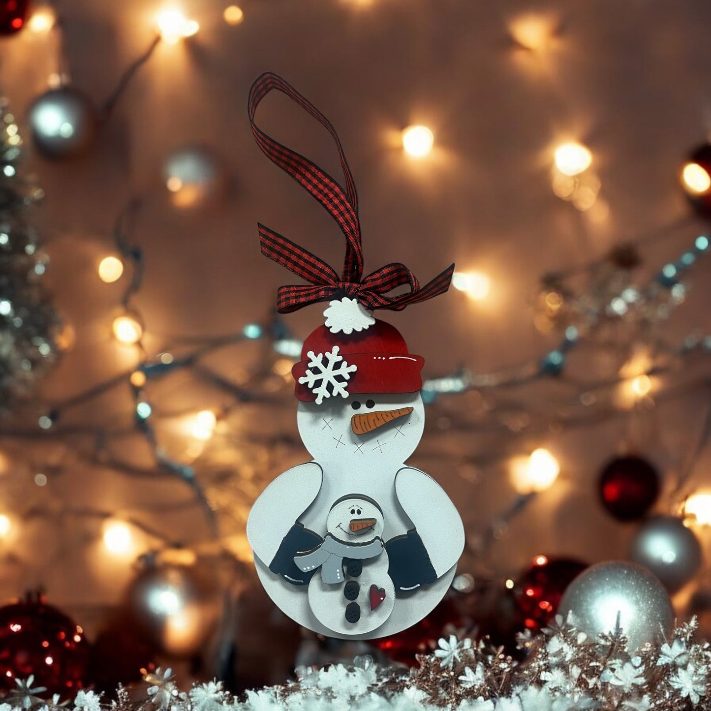 Snowman holding Snowman Baby Ornament